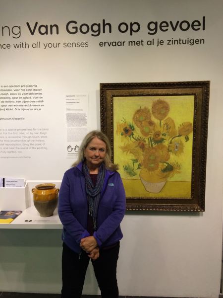 Joy in from of sunflowers