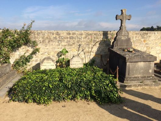 2 grave stones with ivy